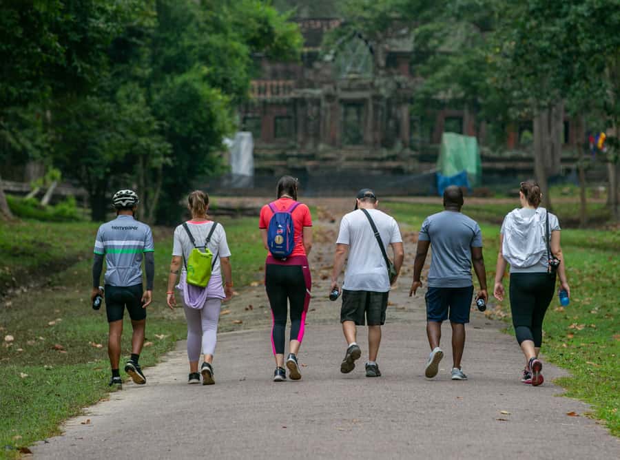 Angkor Wat: Guided Sunrise Bike Tour w/ Breakfast and Lunch - Angkor Thom and Bayon’s stone faces