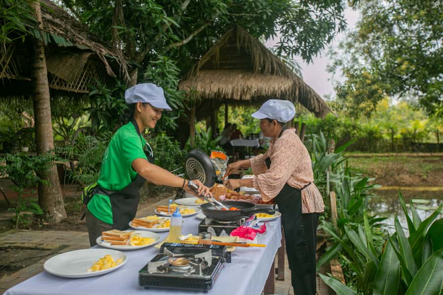Angkor Wat: Guided Sunrise Bike Tour w/ Breakfast and Lunch - Ta Prohm, the Tomb Raider temple