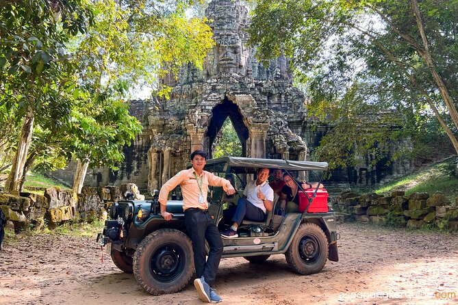 Angkor Wat Sunrise and Market Tour by Jeep - Ta Prohm, where trees share the ruins