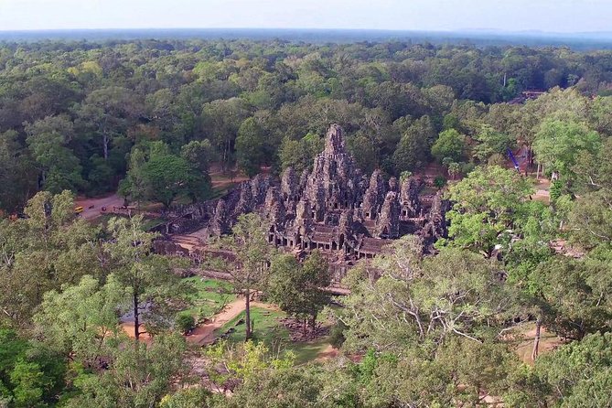 Angkor Wat Sunrise Guided Join-In Tour/Private Tour - Angkor Thom and Bayon: stone faces and royal scale