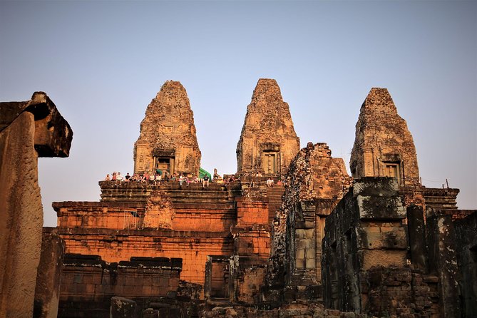 Best Temples Day Tour in Siem Reap with Sunset - Ta Prohm, where trees press into the ruins