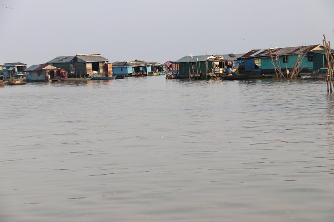 Guided Floating Village Boat Tour in Siem Reap - Boarding the long-tail boat