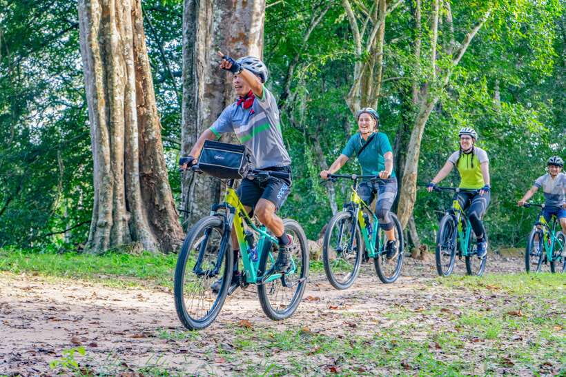 Siem Reap: Angkor Sunset Bike & Boat Tour /E-Bike Available - Riding through Angkor after the main crowds leave