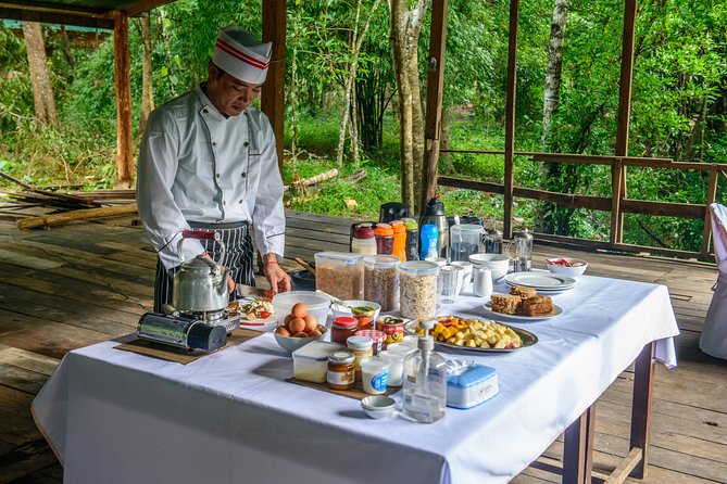 Siem Reap: Angkor Wat Sunrise Bike Tour & Jungle Breakfast - Bayon’s stone faces and Angkor Thom’s old center