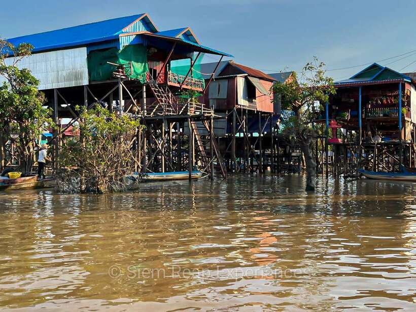 Siem Reap Floating Village Kampong Phluk Sunset with Boat - The covered river boat through the village