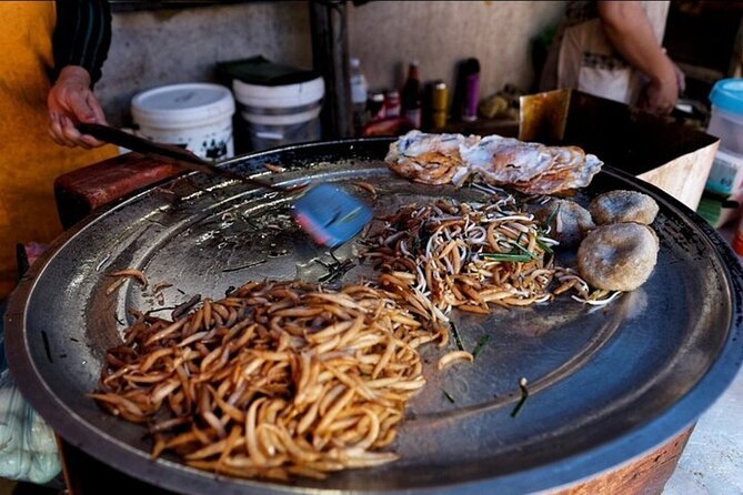 Siem Reap Food Tour By Local - Stop three: a Cambodian savory fried cake at Wat Bo