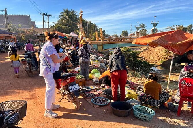 Siem Reap: Morning Bike Tours with Local Market & Lunch - A quiet pause at the Buddhist temple