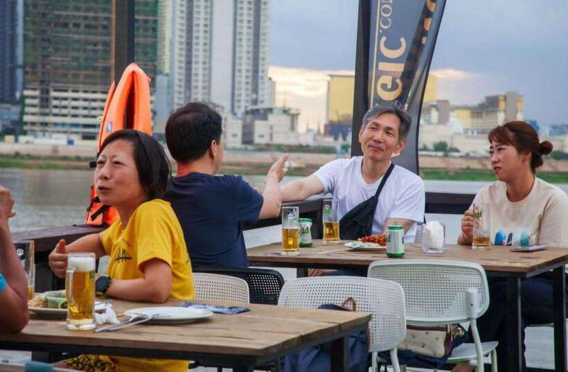 Sunset Cruise Unlimited BBQ Buffet, Cold Beers, Soft Drinks<em> – Key points to know before you board’ /></p>
<ul>
<li><strong>The 5pm departure is the sweet spot:</strong> You can see Phnom Penh in daylight, catch the sunset, and watch the city lights appear.</li>
<li><strong>Three packages keep the price flexible:</strong> Pick cruise-only, unlimited beers and soft drinks, or unlimited BBQ, fruit, beers, and soft drinks.</li>
<li><strong>The route covers three waterways:</strong> The boat travels through the Mekong, Tonle Sap, and Four Faces rivers.</li>
<li><strong>Hotel pickup is included within 4 km of the dock:</strong> A tuk tuk usually arrives between 4:15pm and 4:30pm with a Mekong Magic sign.</li>
<li><strong>The staff are the strongest part of the operation:</strong> Hannah and Bamboo are names connected with warm, attentive service.</li>
<li><strong>This is a scenic social ride, not a guided city tour:</strong> You get river views and a relaxing atmosphere, but little formal commentary.</li>
</ul>
<h2>Why Phnom Penh is worth seeing from the Mekong</h2>
<p><img width="820" height="615" decoding="async" src=