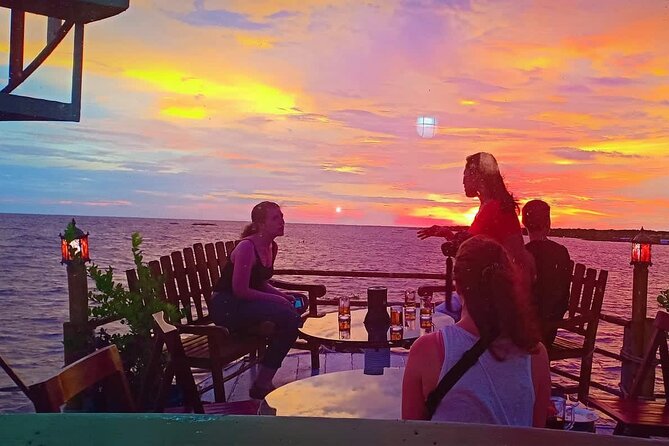 Sunset Dinner and drinks includes a Floating Village cruise tour. - The lotus farm makes a worthwhile first stop