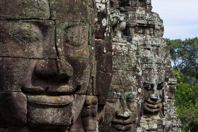 The Angkor Temples from Sunrise by Tuk Tuk - Angkor Thom and the many-faced Bayon