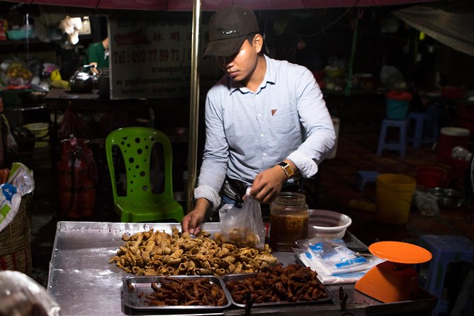 Ultimate Phnom Penh Food Tour by Tuk Tuk: 20 Tastings and Drinks - Russian Market after dark: ingredients, fruit, and smoky ribs